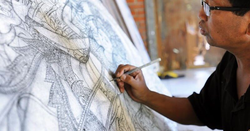 Bali’s traditional painter with finer art painting works at Batuan village